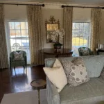 a living room with a couch and chairs