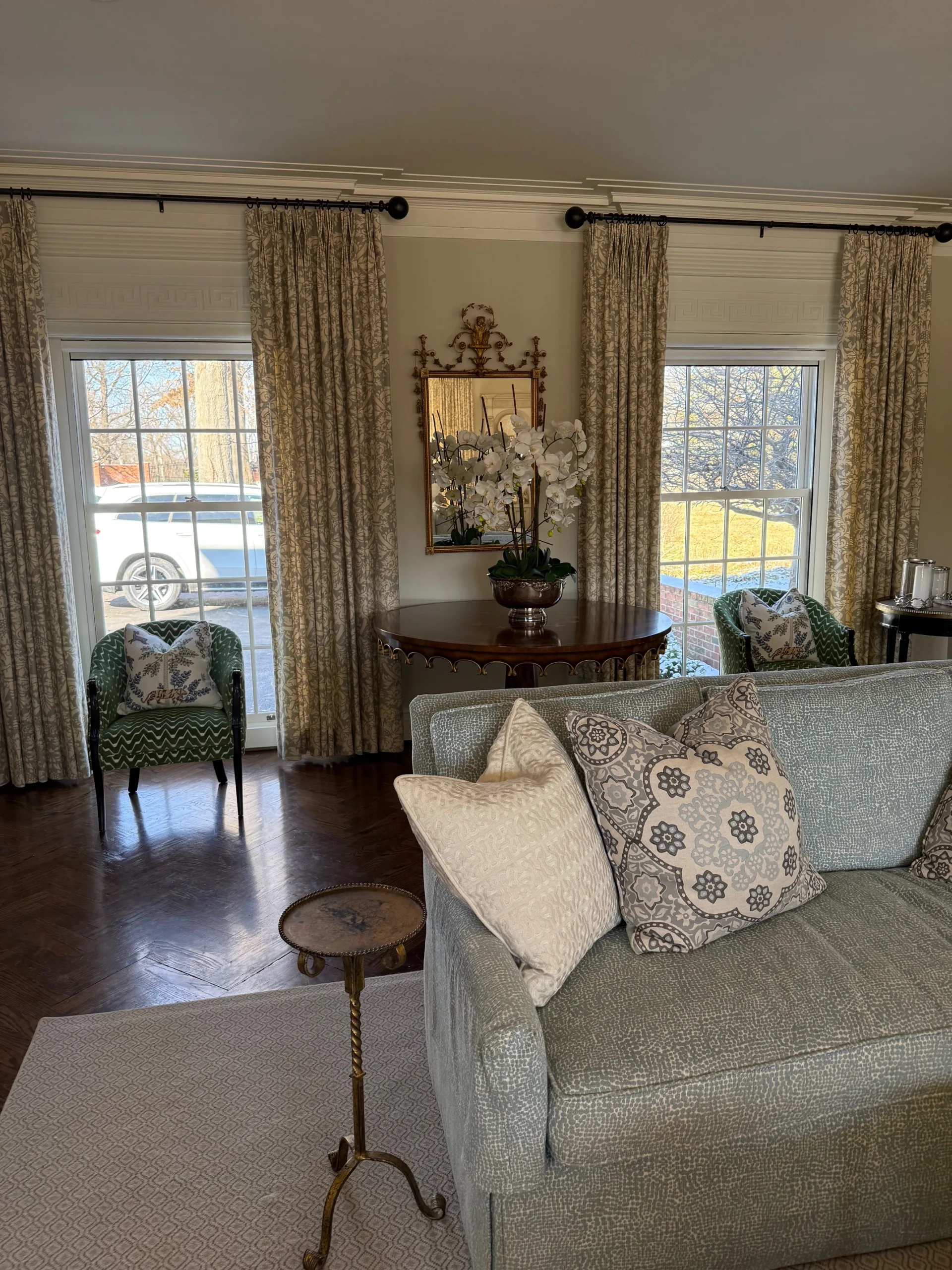 a living room with a couch and chairs