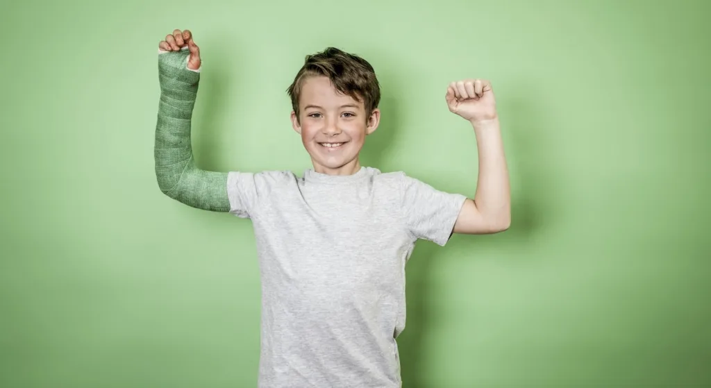 boy with broken arm with green cast