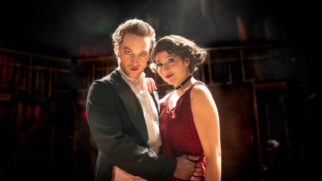 Spencer Davis Milford as the Emcee and Hailey Medrano as Sally Bowles in the New Jewish Theatre production of Cabaret.