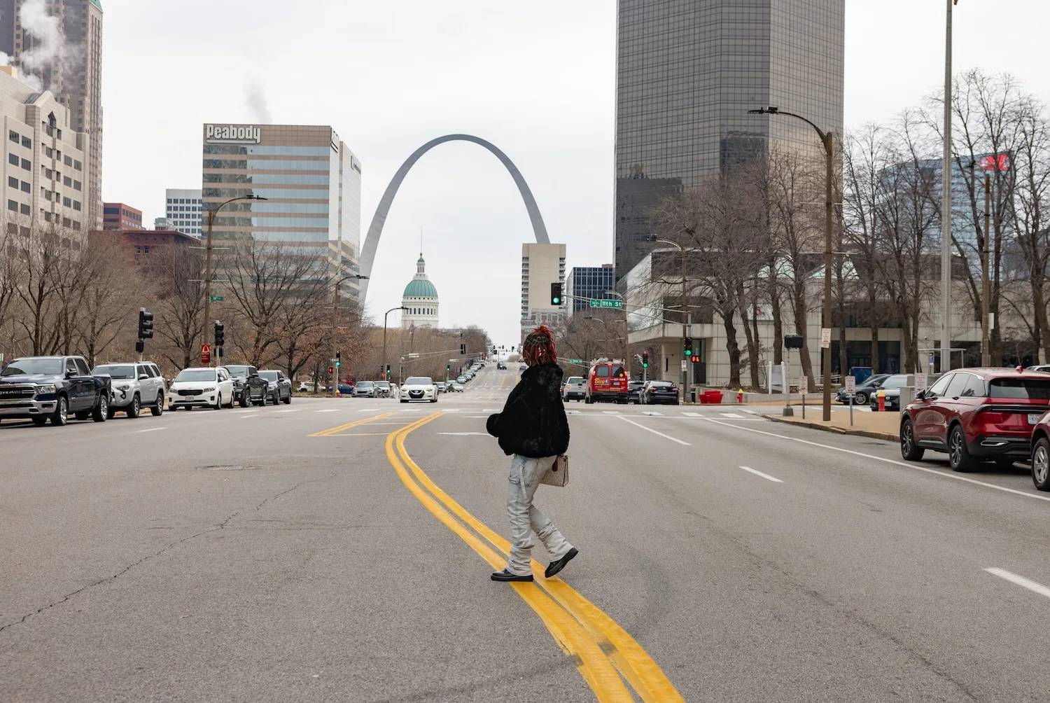 Khyla Mason, 22, walks across Market Street after a court appearance Friday, December 13, 2024.