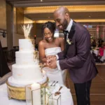 Lauren and Marcus Lee cut their wedding cake.