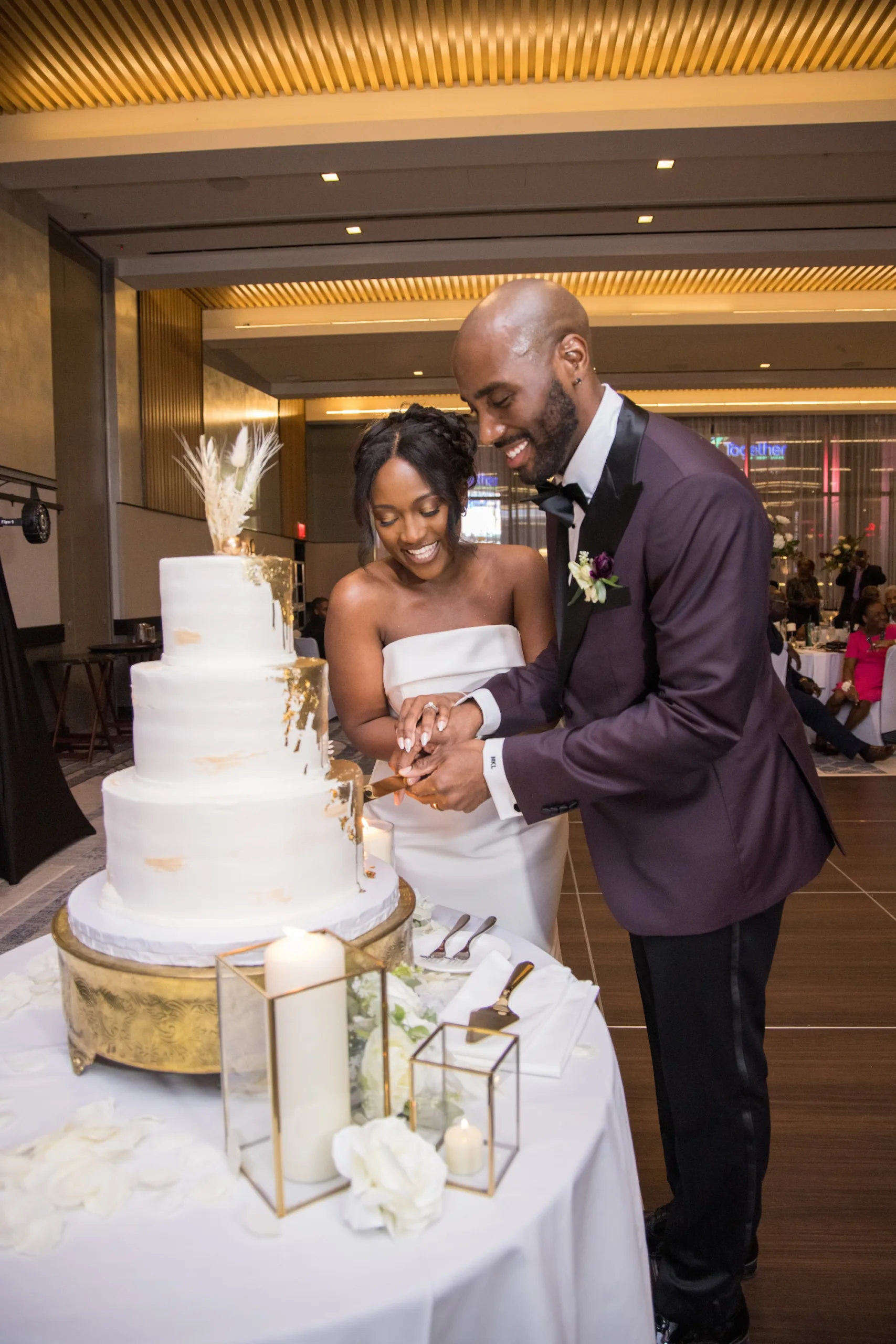 Lauren and Marcus Lee cut their wedding cake.
