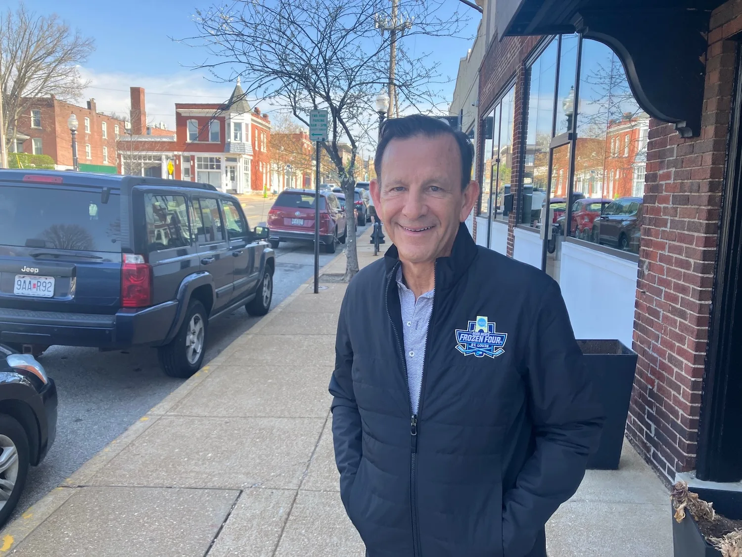 Chris Zimmerman wears a Frozen Four-branded jacket.