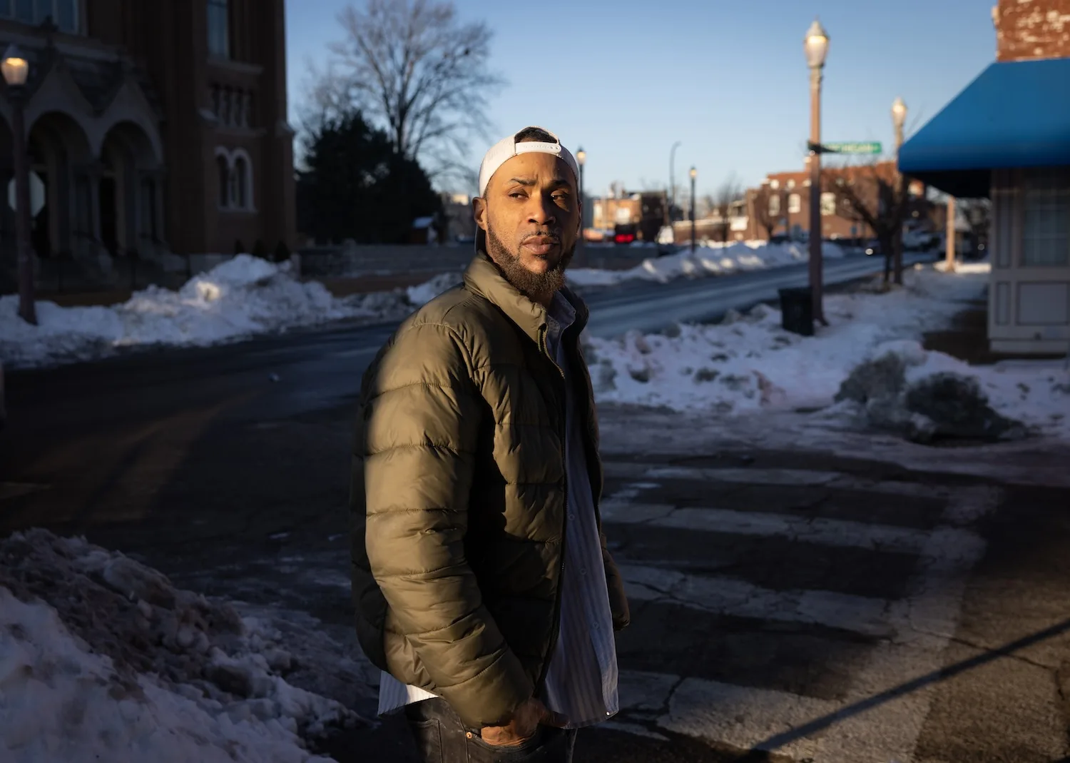 Wearing a ballcap and jacket, James Neal stands on a snowy St. Louis street.