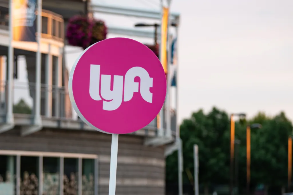 Lyft's white logo on a pink sign