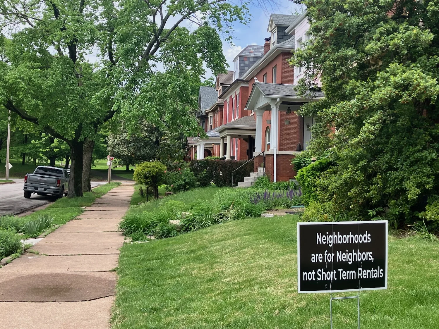 A lawn in St. Louis' Compton Hill neighborhood states that "Neighborhoods are for neighbors, not short-term rentals."