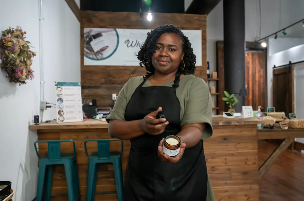 Ashley Morgan shows a skin care product.