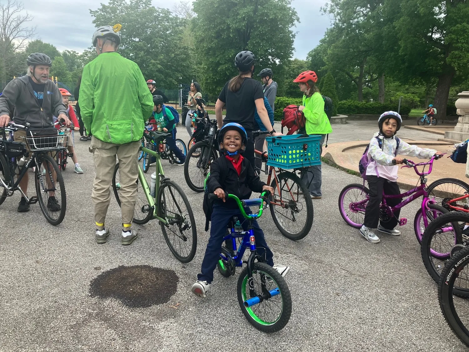 Ronald Taylor, center, gets ready for a bike bus in Tower Grove Park.