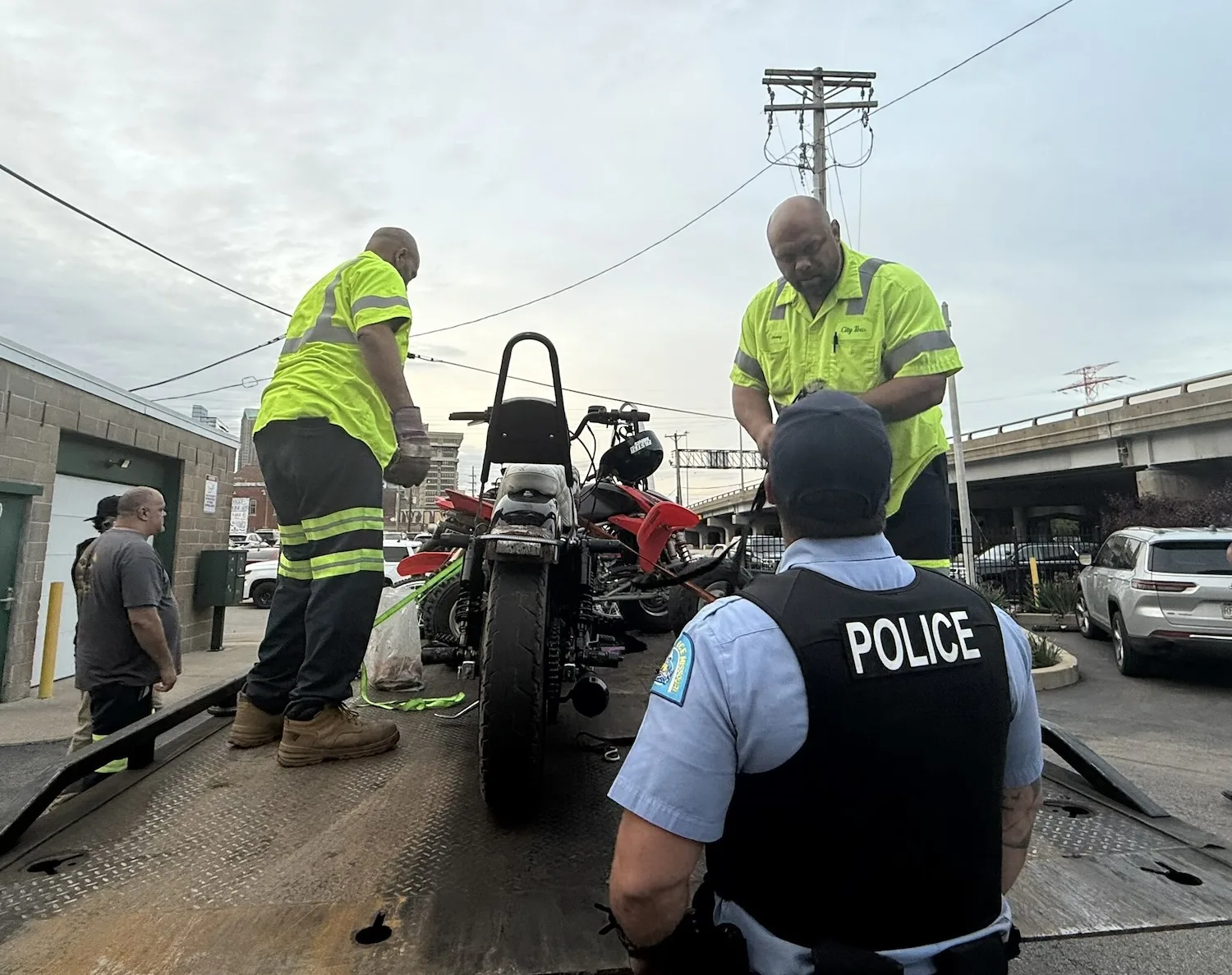 St. Louis Police seize an ATV and take it away in a tractor-trailer.