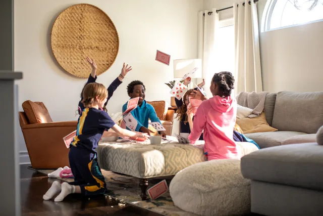 Kids play games wearing Lion+Owl clothing.