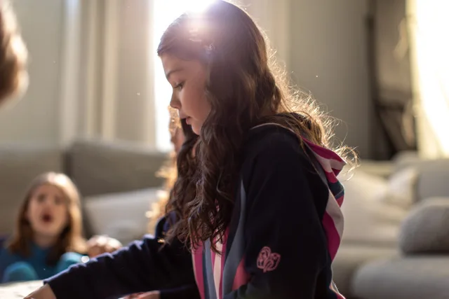 Child wears Lion+Owl hoodie.