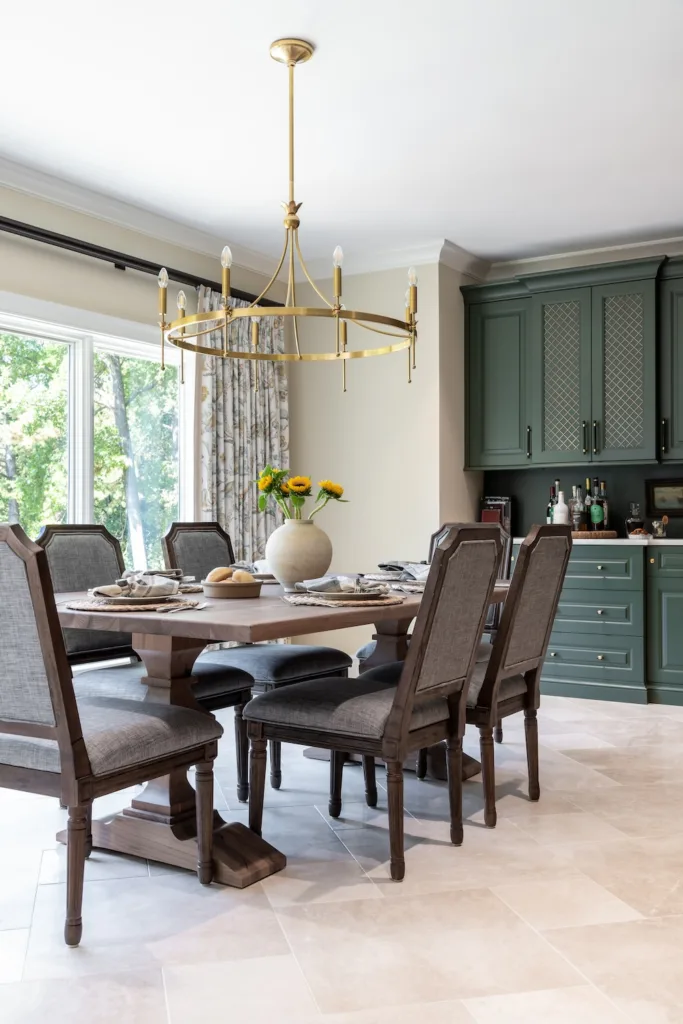 A clean-lined gold fixture delivers striking contrast, its simplicity bringing calm balance to the kitchen’s more dynamic design elements.
