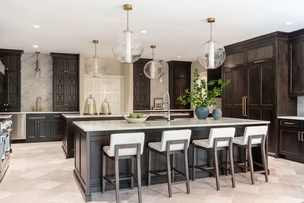 The kitchen features two large orb pendants provided by Metro Lighting