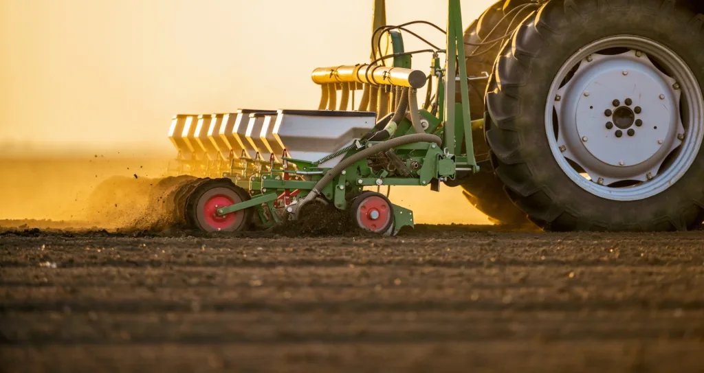 Tractor equipment seeding, sowing crops on a farm