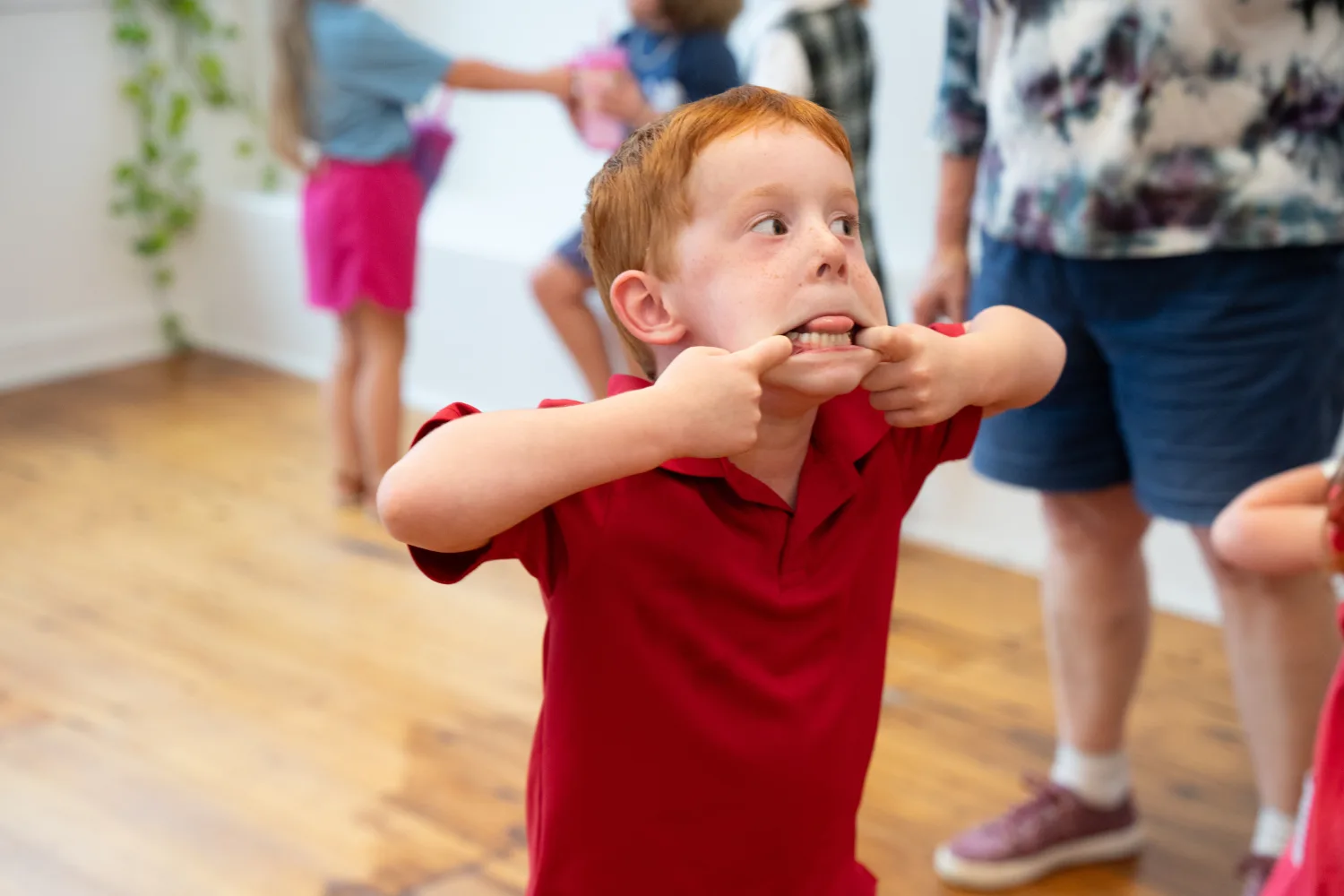 Child sticking tongue out at Ice Cream social