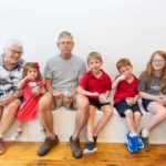 two adults and four children at the SLM ice cream social