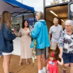 Cheryl Baehr chatting with guests outside the ice cream social