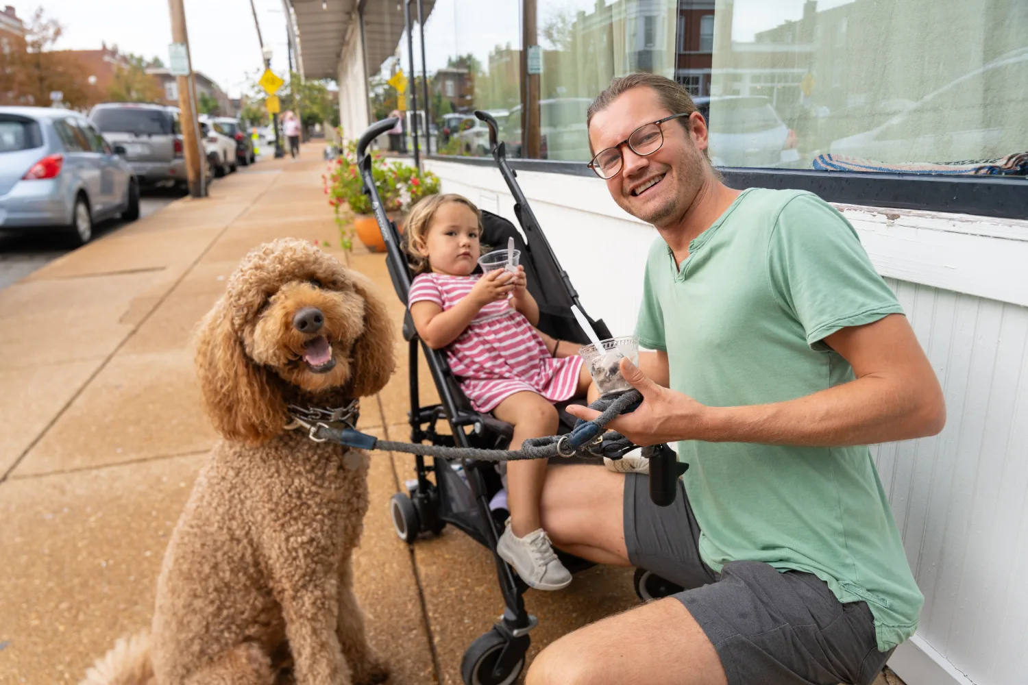 Dog, child and adult at the Ice Cream Social