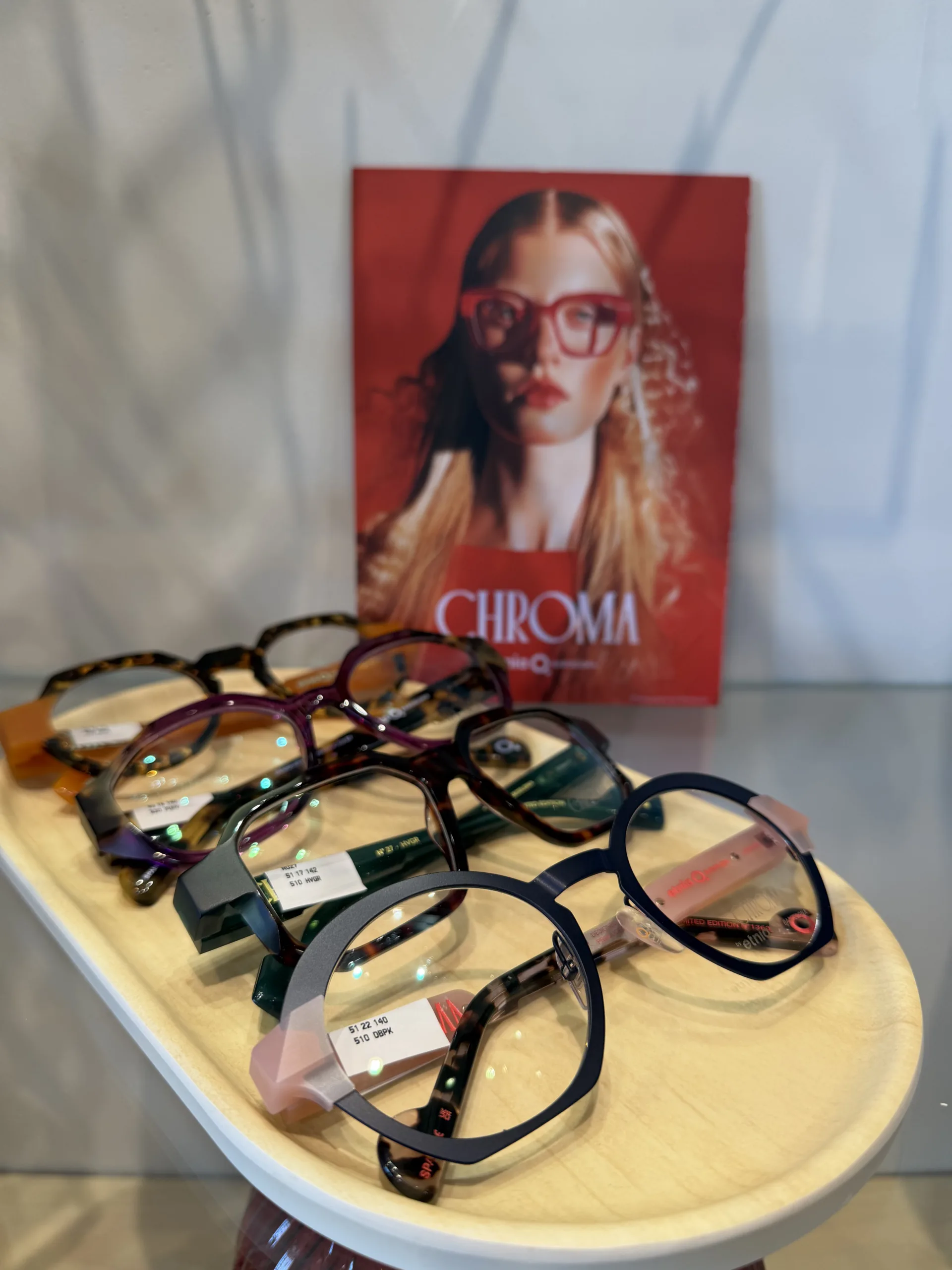 Display of CHROMA eyeglass frames in rich jewel tones at Eyewearhaus.