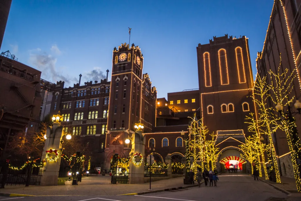 Holiday lights outline the historic brewhouse buildings and trees during Brewery Lights.