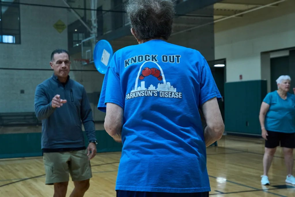 People work out in a gym.