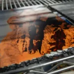 A piece of black slate with a photo on it.
