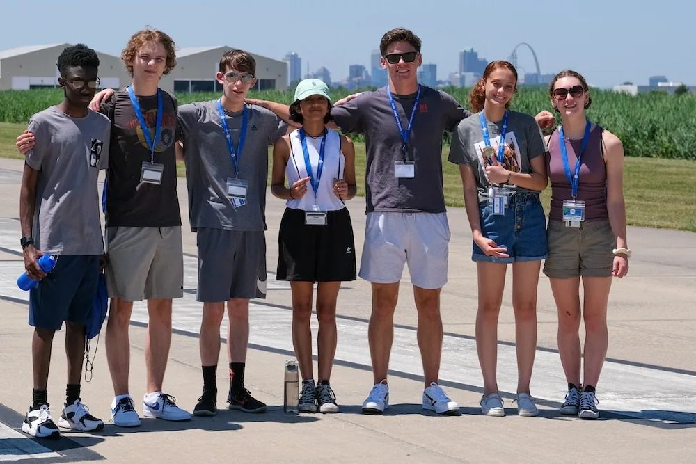 Aviation campers together on an airport runway.