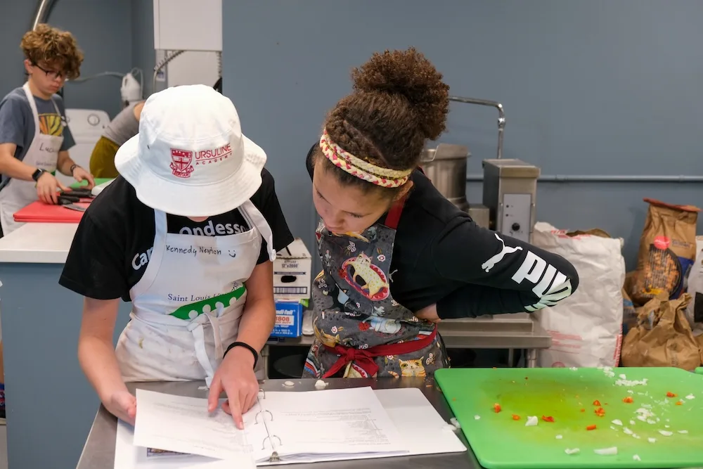 Culinary campers participating in a cooking activity.