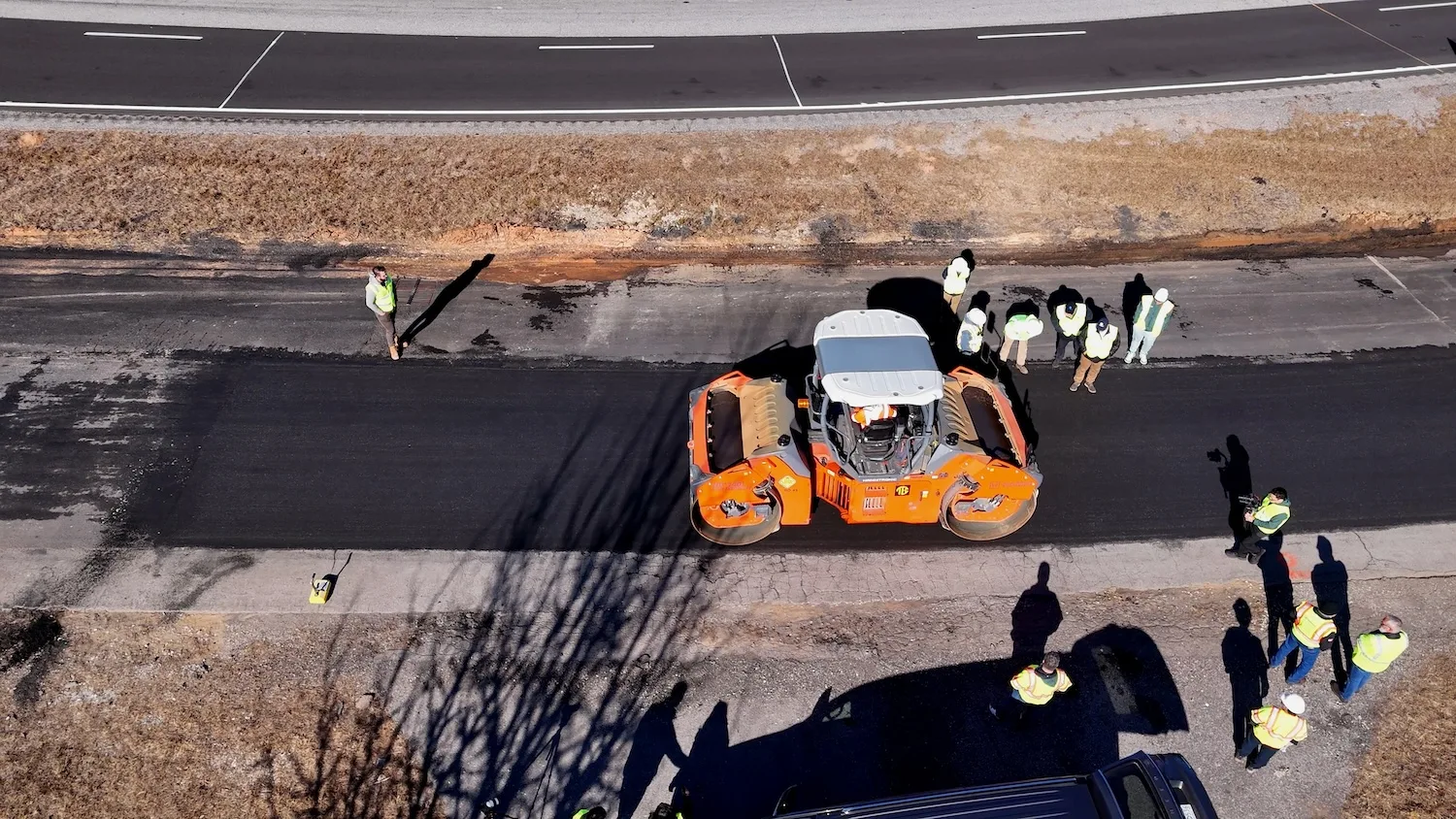 Asphalt is laid on a road.