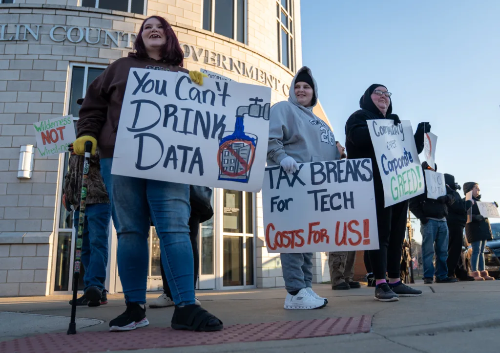 People holding signs