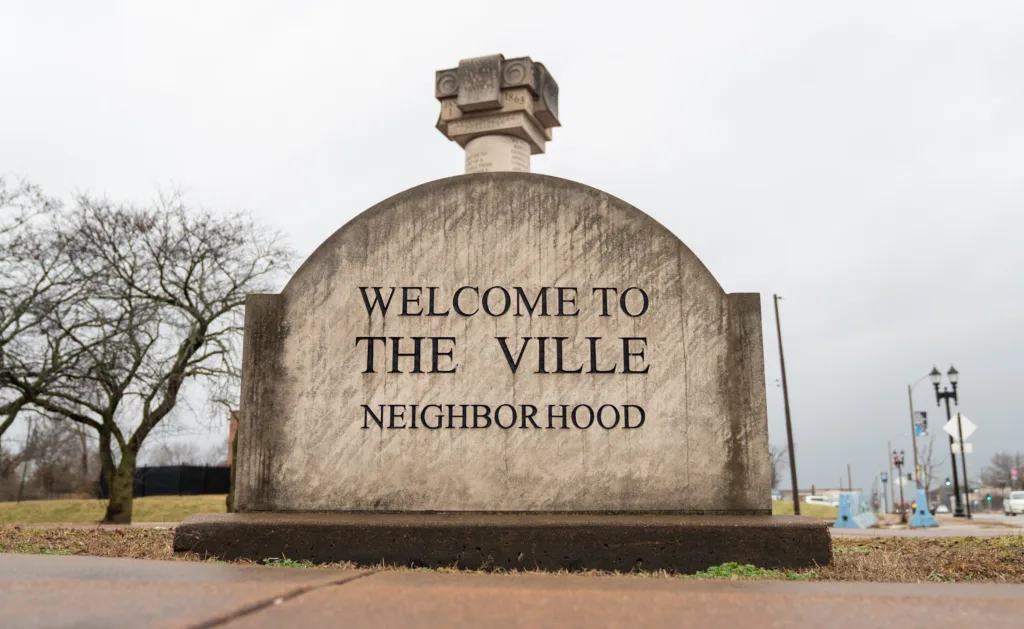 A monument that says "Welcome to The Ville neighborhood."