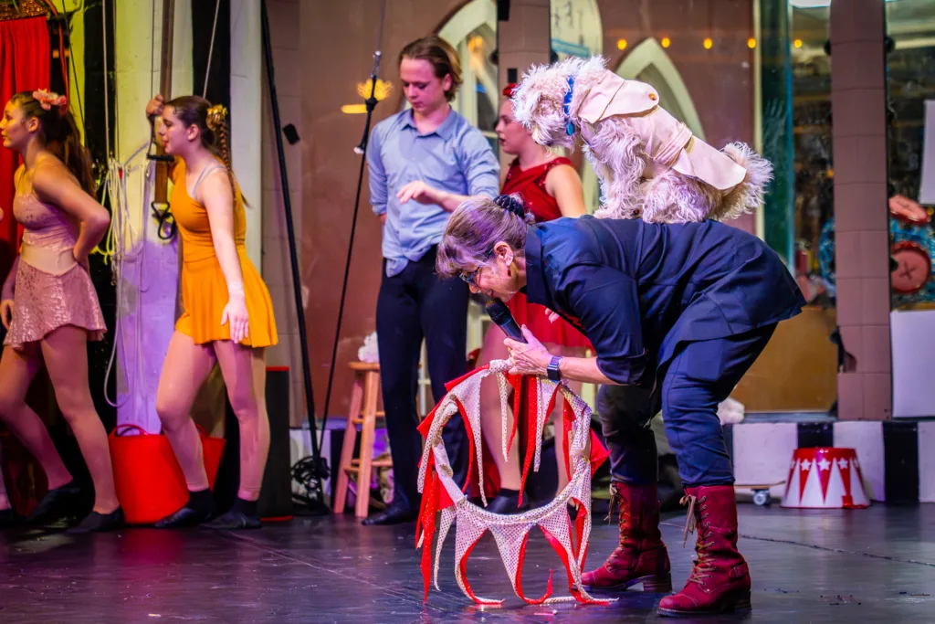 Circus Harmony's mascot, Marvelous Miss Maple, performs tricks alongside essica Hentoff, the Artistic/Executive Director and founder of Circus Harmony.