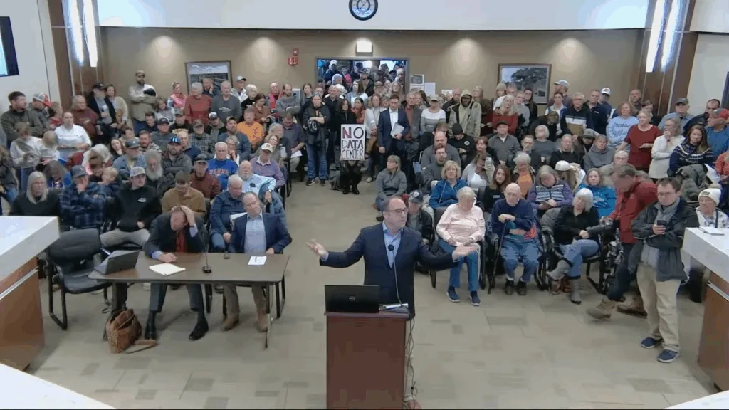 A speaker in front of a podium