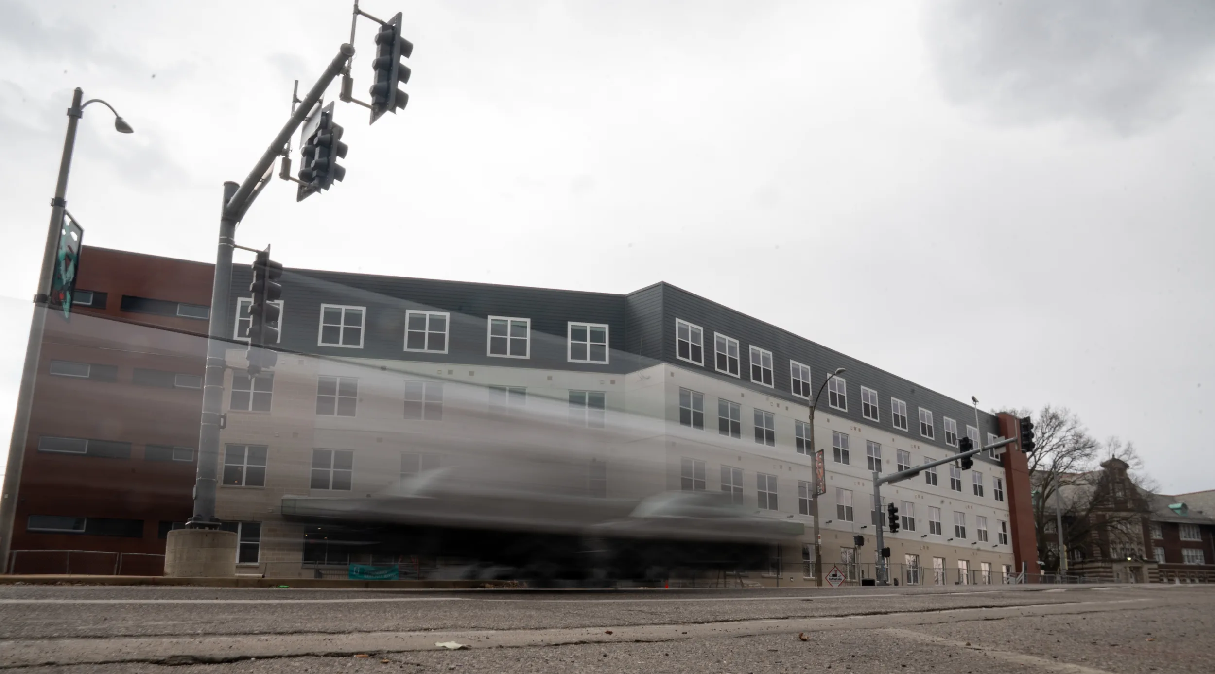 Cars blurred in front of a building