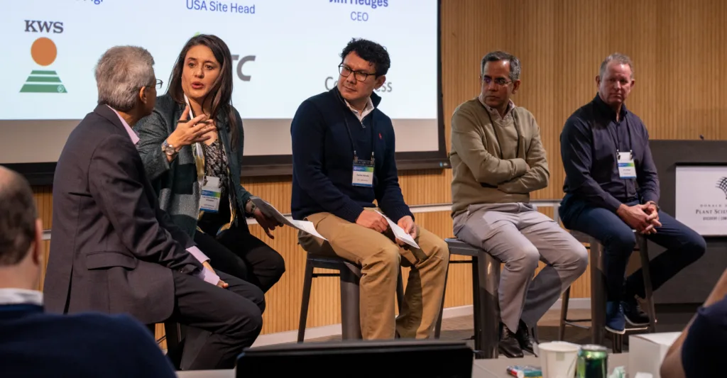 A panel of speakers on chairs
