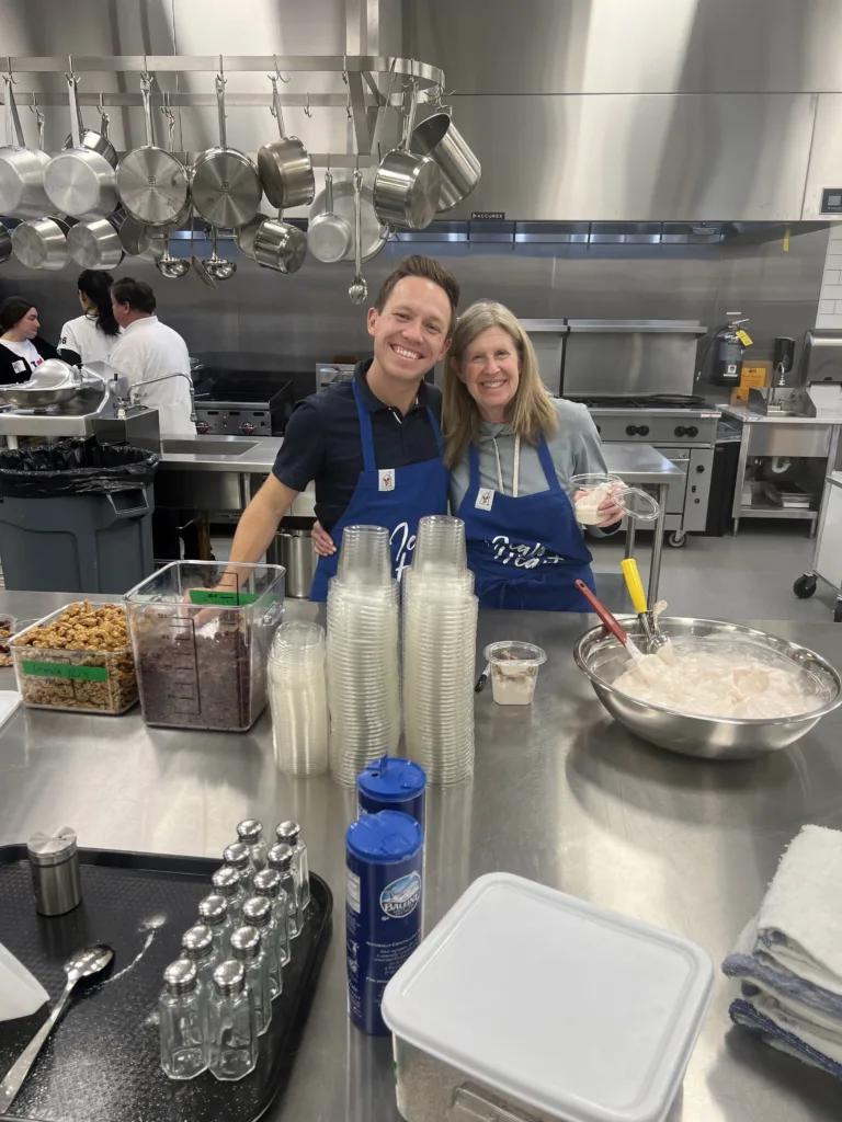 Volunteers prepare and serve dessert during a Meals from the Heart evening at Ronald McDonald House Charities of St. Louis.
