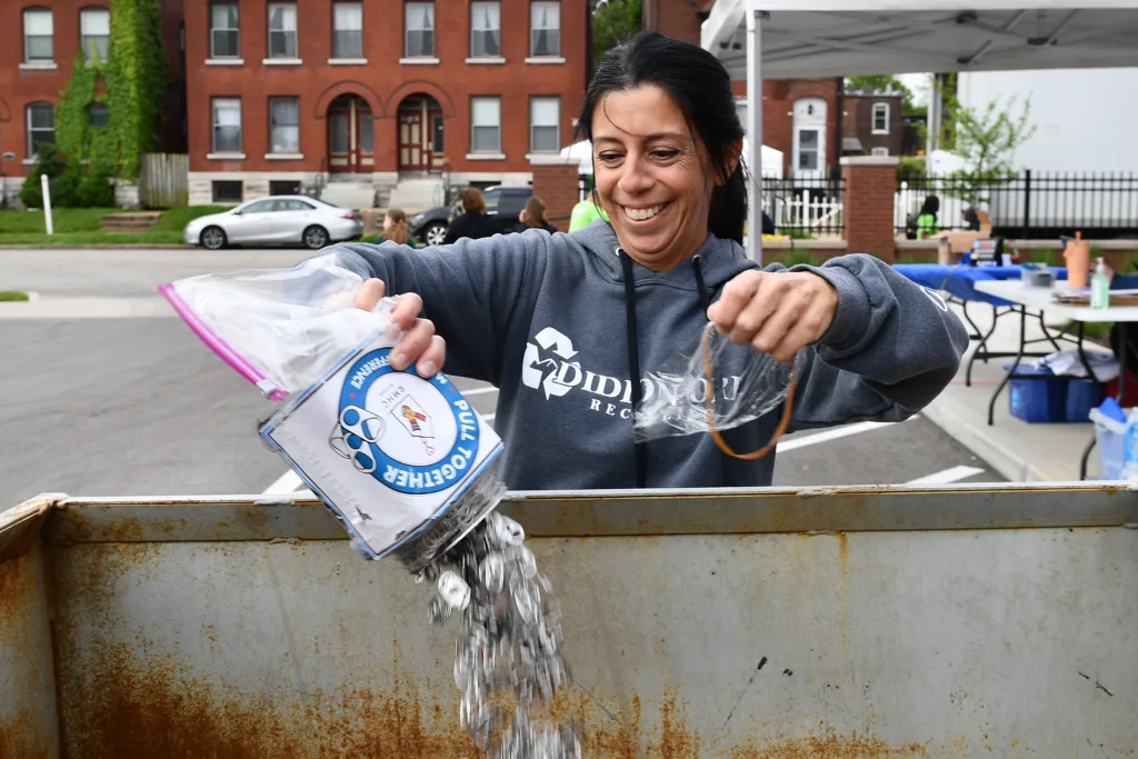 A volunteer adds collected pull tabs to a donation bin benefiting Ronald McDonald House Charities of St. Louis.