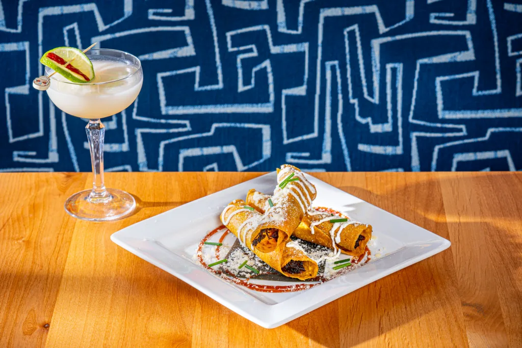 Lapez Mod Mex: Duck Taquitos; crisp tortilla flutes, duck confit, caramelized onions, Chihuahua cheese, tamarind-ancho sauce