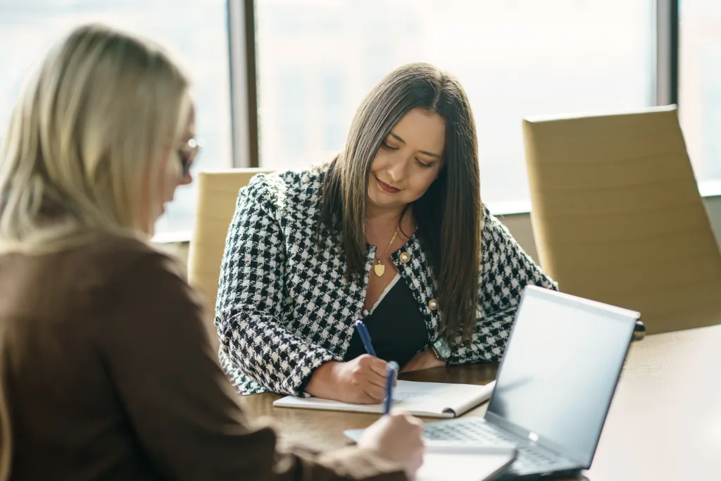 Capes Sokol associate Melissa DeClue and counsel Ajla Alunovic share ideas.