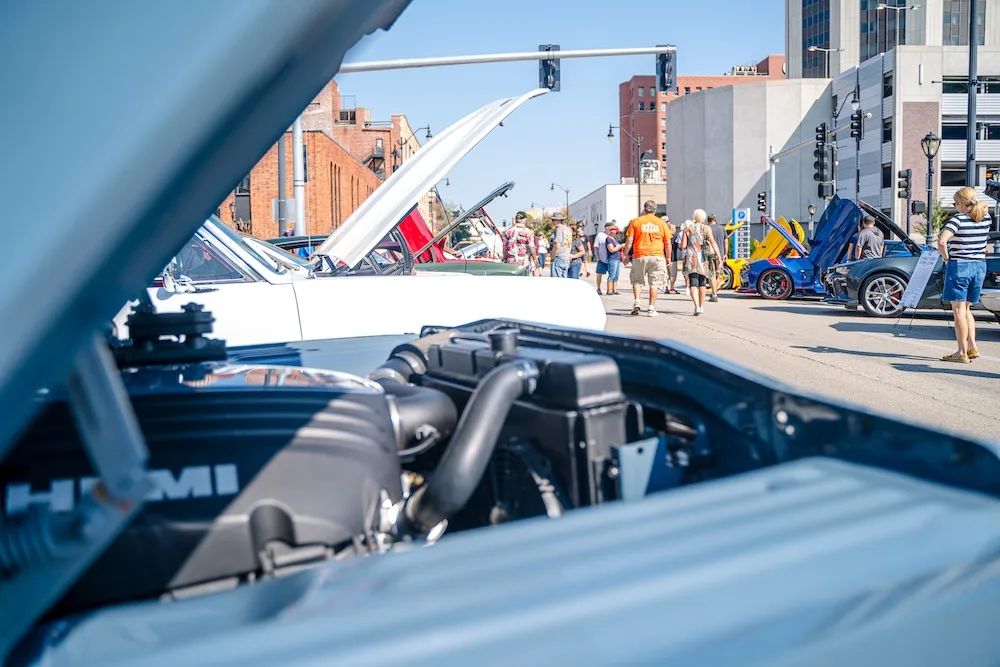 Classic cars line Springfield streets during a Route 66 car show.