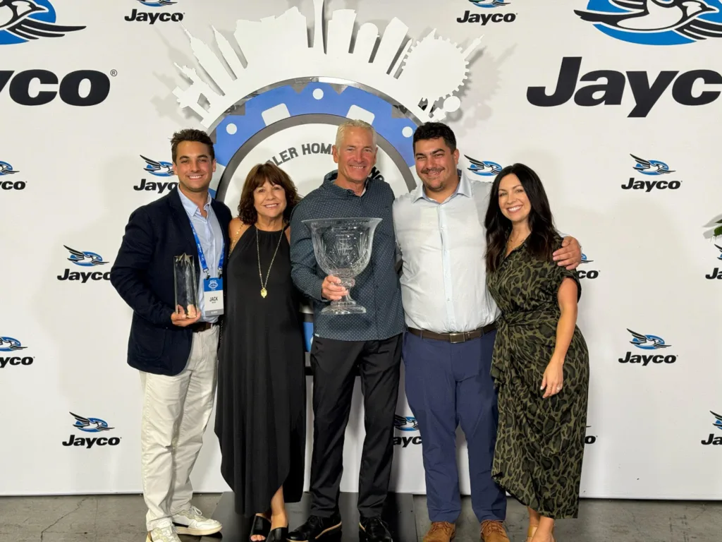 The Meyer family celebrates their industry accomplishments and awards at a Jayco event.