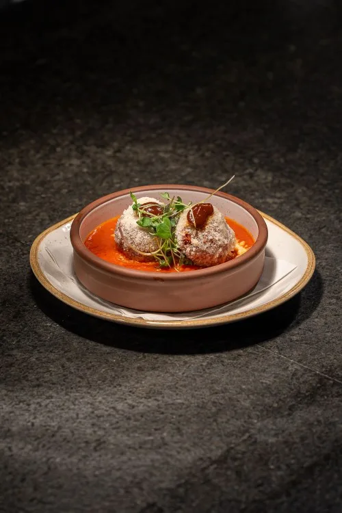 Antipasto Caldo | crispy meatballs + radicchio agrodolce + basil + parmigiana + pomodoro