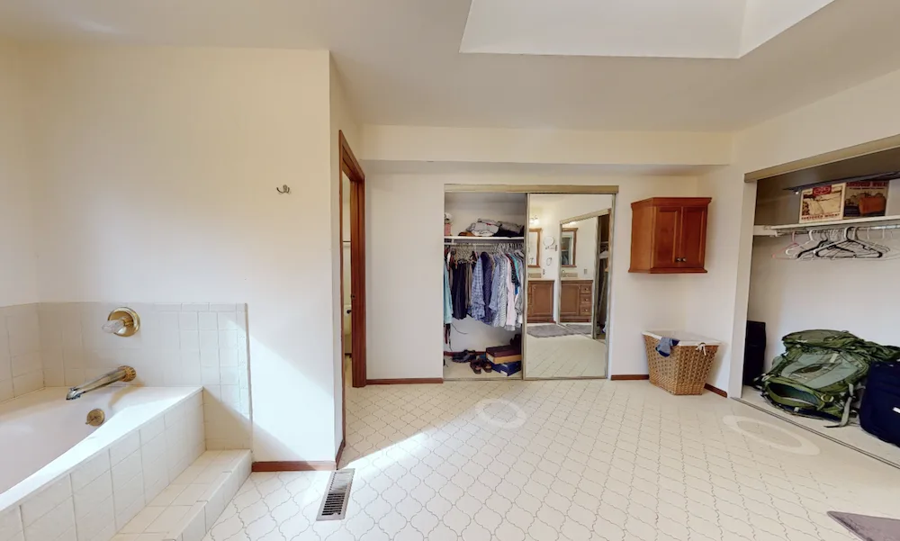 Before: The existing layout included traditional bathroom fixtures and a more straightforward floor plan.
