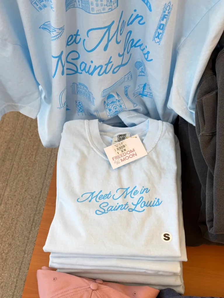 Light blue “Meet me in Saint Louis” tee shirt from Freedom & the Moon. Available at the Missouri History Museum shop, Sold on St. Louis.  