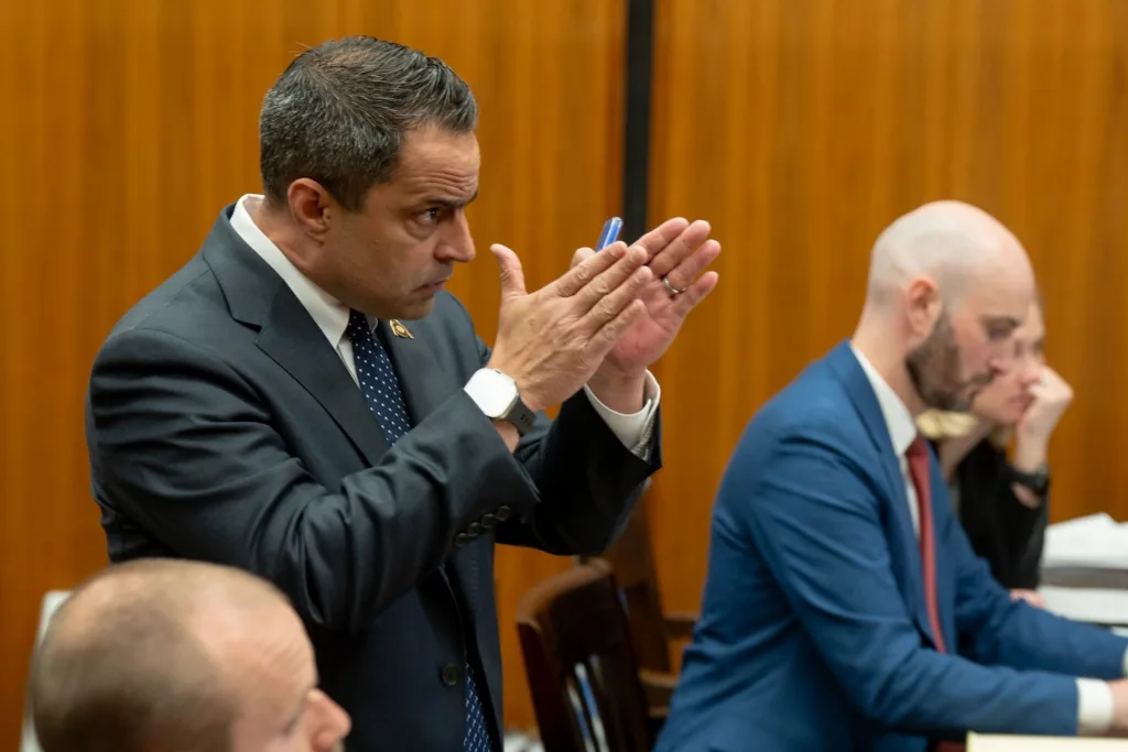 An attorney gestures in court.