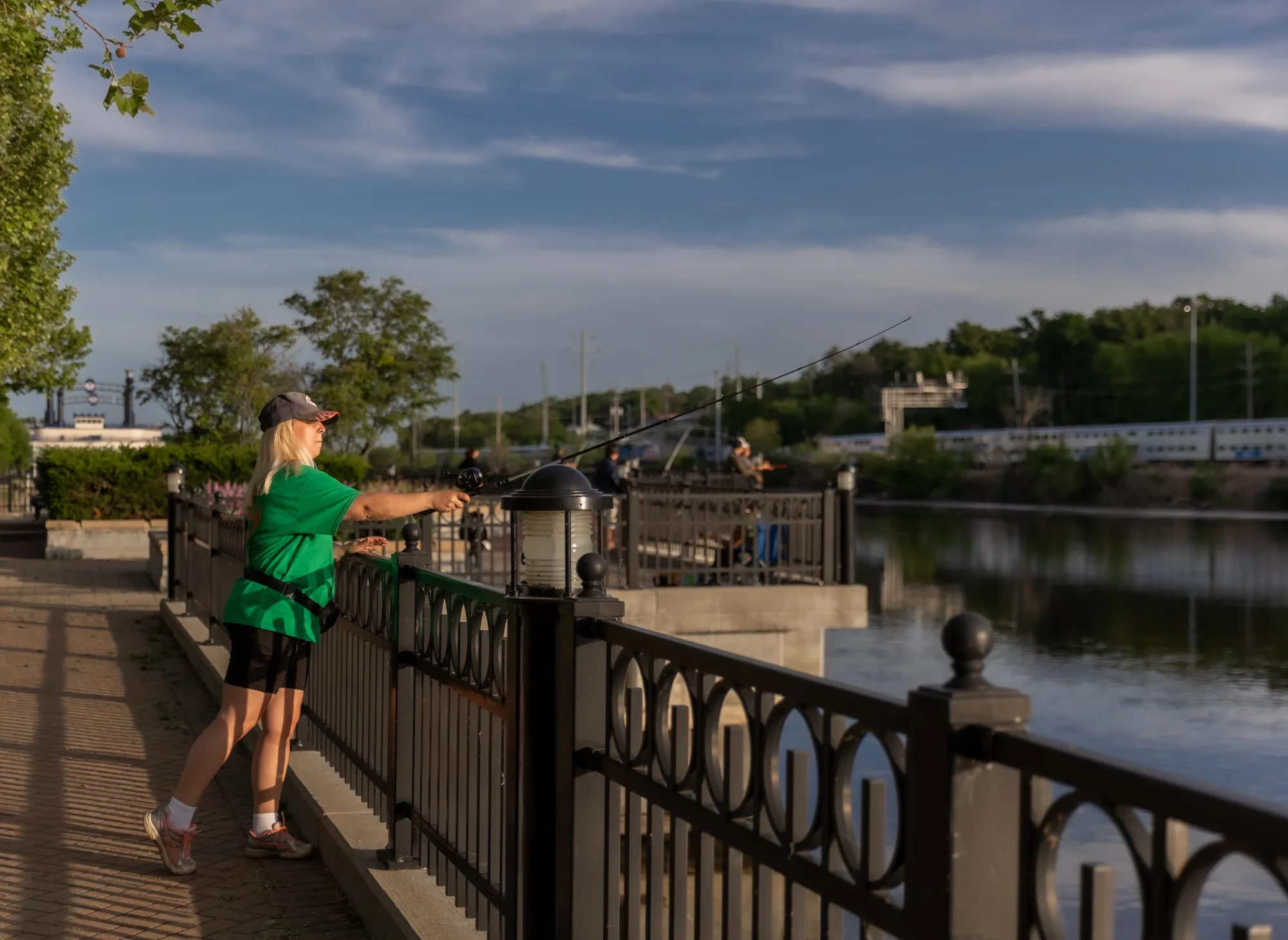 People can enjoy fishing along the scenic Fox River waterfront