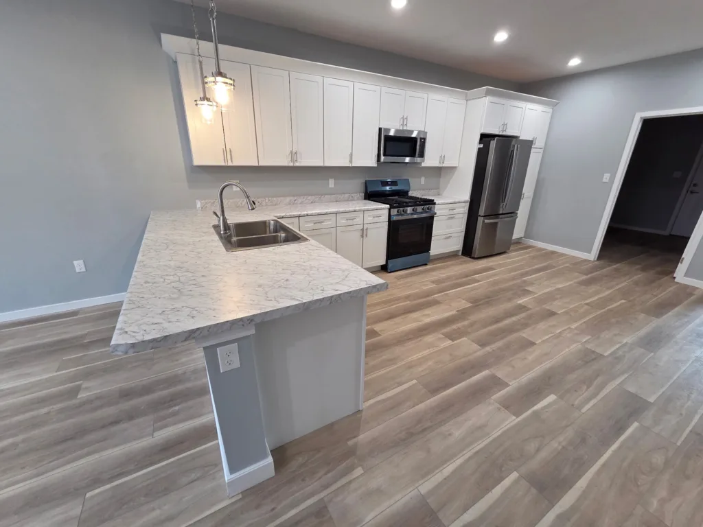 A newly completed Habitat for Humanity kitchen showcases donated cabinets and finishes that help turn a house into a home.