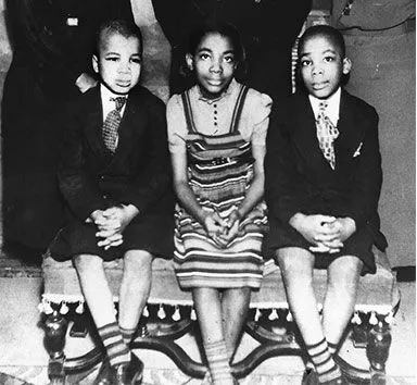 Ten-year-old Martin Luther King, Jr. (far right) sits with his siblings for a family photo.