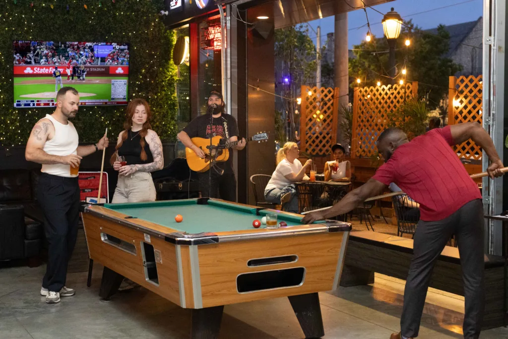 The Delmar Loop offers visitors games, drinks, live music, and inviting outdoor patio spaces for socializing and entertainment.